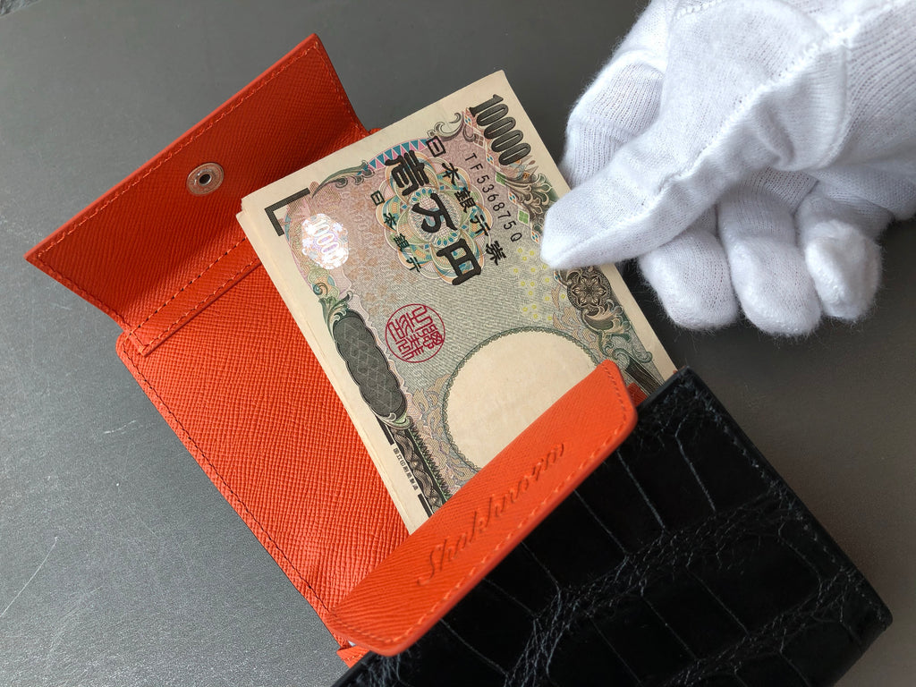 黒と橙色クロコダイル革の二つ折りミニ財布 札入れ
