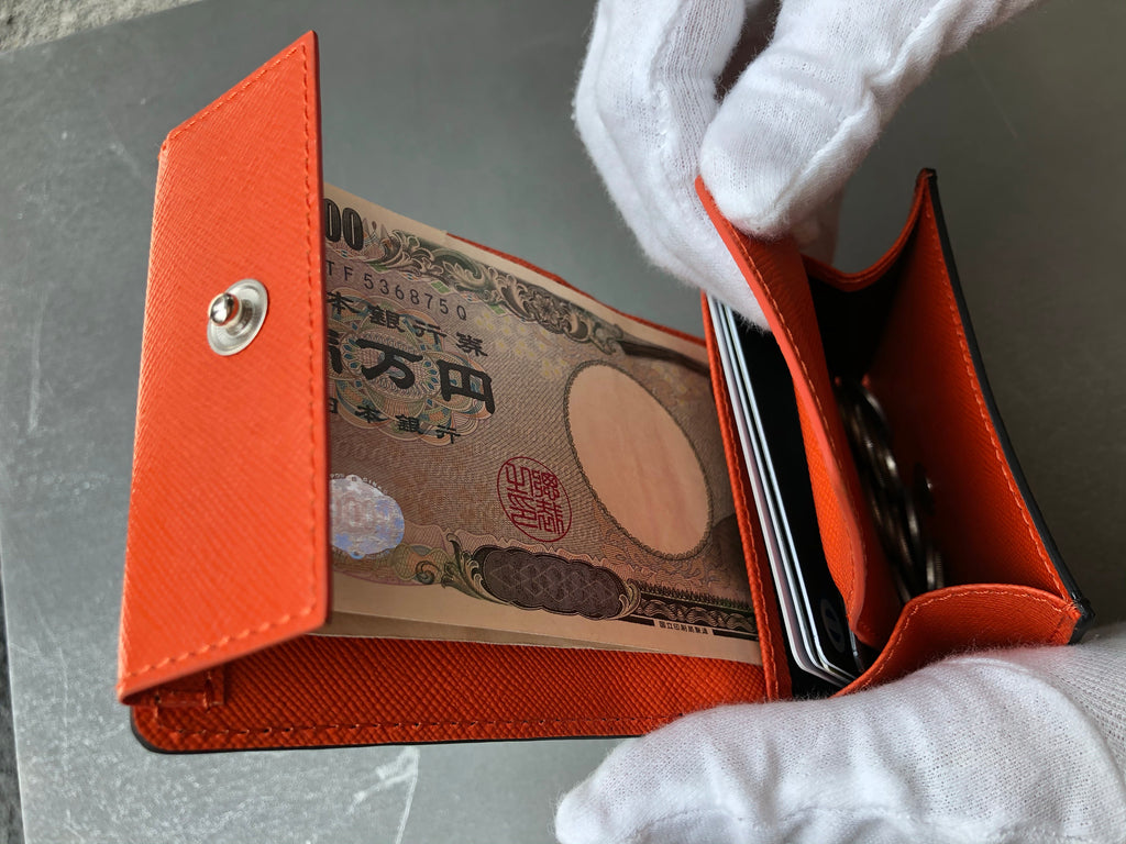 黒と橙色クロコダイル革の二つ折りミニ財布 コインケース