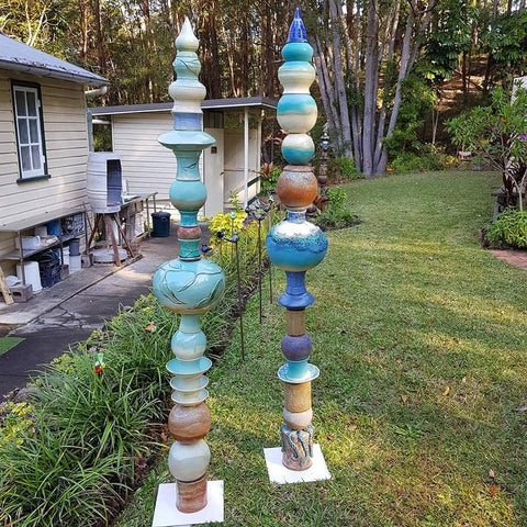 a sculpture made of blue and brown pottery
