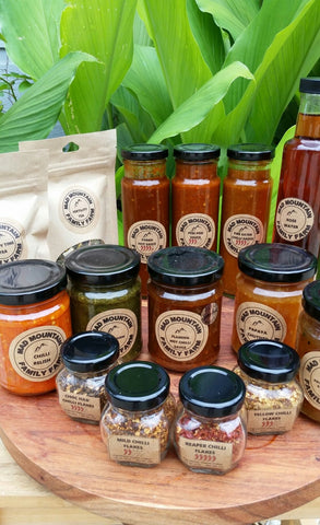 A selection of jams and sauces sitting on a table made by Mad Mountain Family Farm.