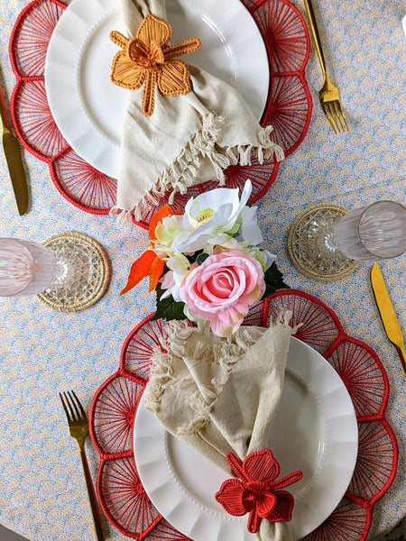 Table settings with vibrantly colored woven placemats