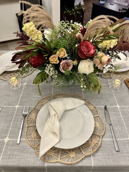 Table Settings with woven scalloped placemat and grey tablecloth