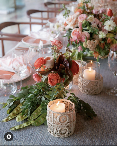 table centerpiece with woven candle holders