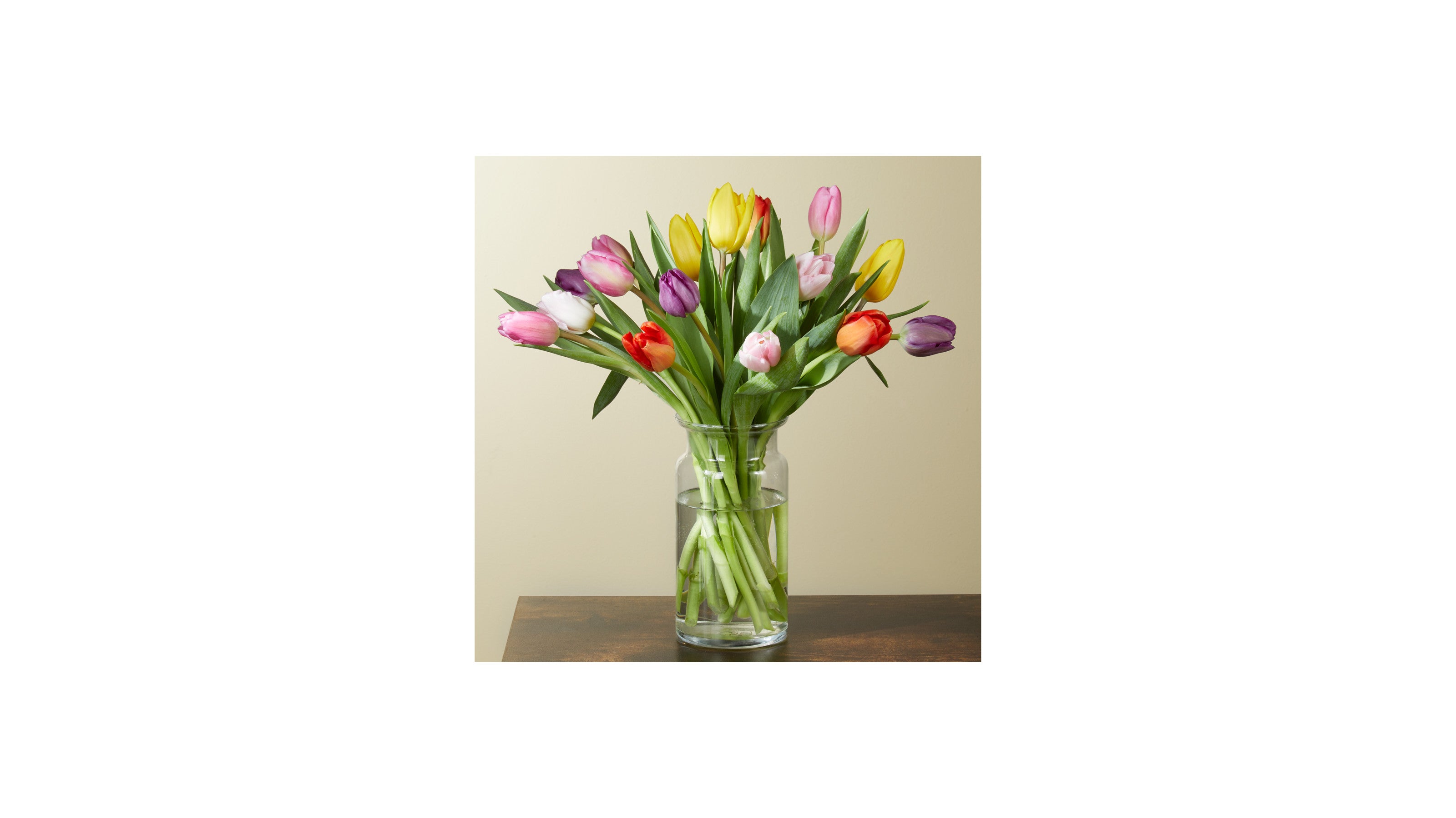 Spring Breeze Multicolored Tulip Bouquet Tulips and other fresh flowers are staggered glass bottles in a tool box. spring breeze multicolored tulip bouquet