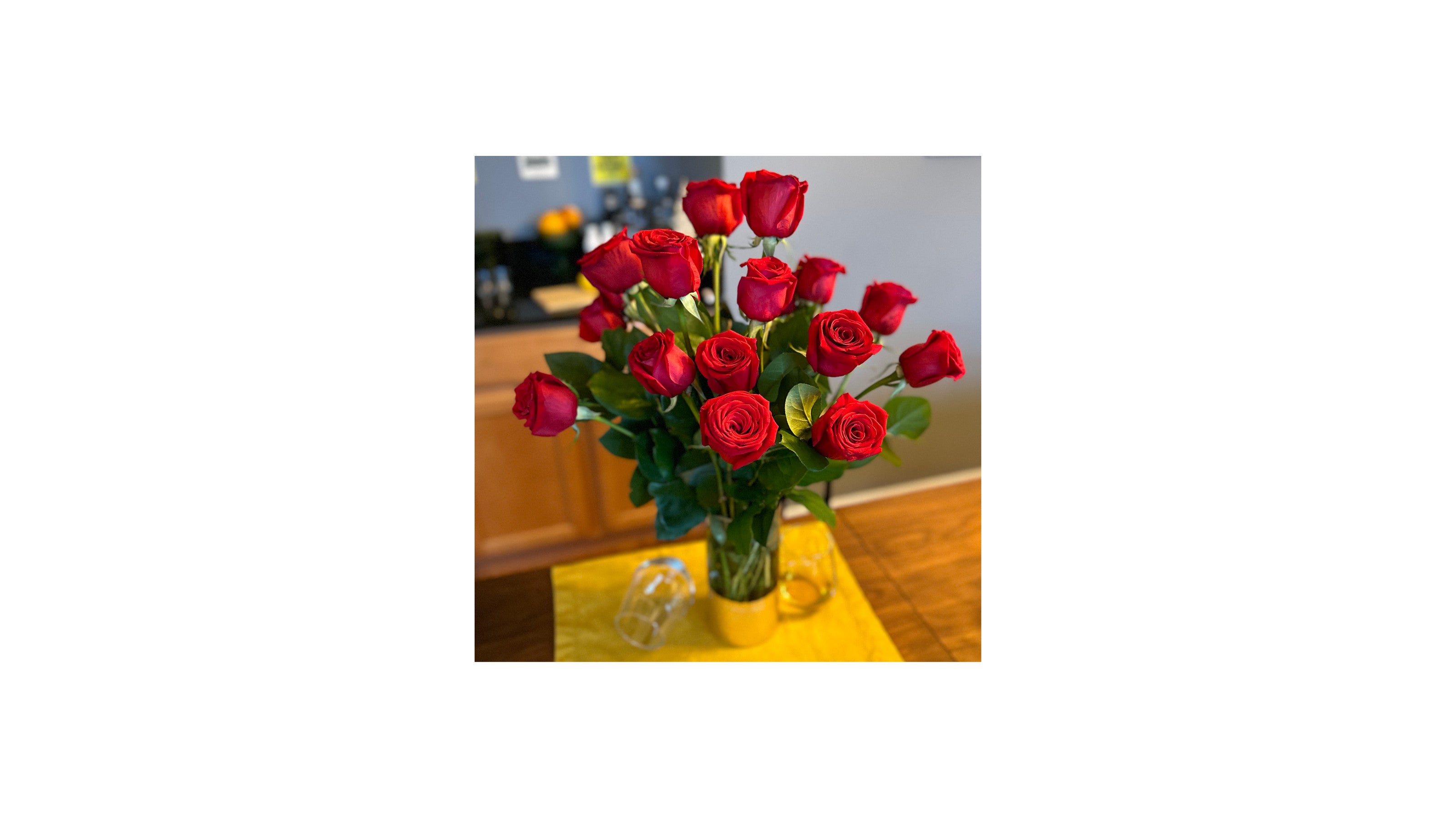 red dead single rose in vase
