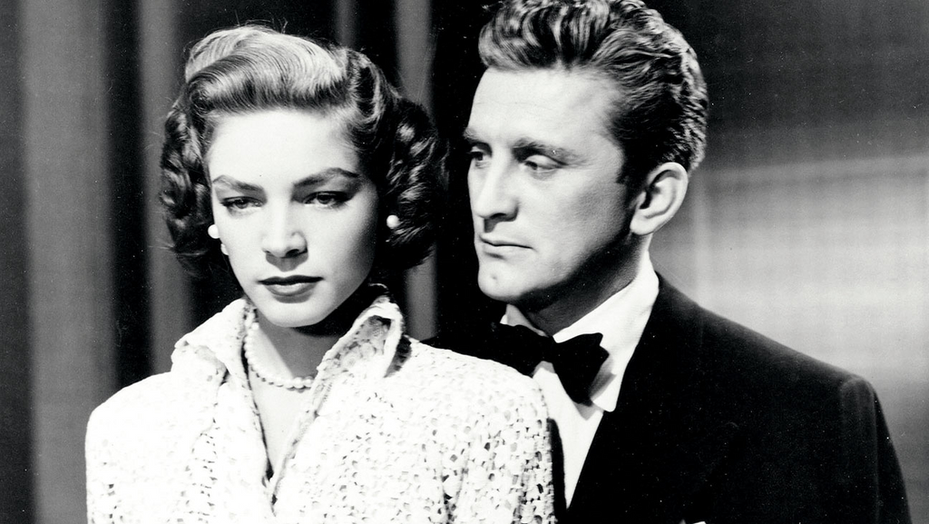 A still from the movie Young Man of Music (1950) featuring Lauren Bacall and Kirk Douglas