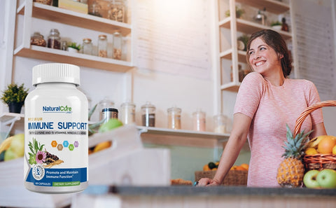 A happy woman with a basket of fresh produce in a kitchen setting with a bottle of "Premium Immune Support" supplements on the counter, indicating a healthy lifestyle for immune system maintenance.