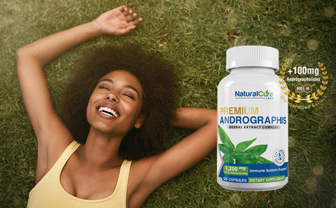 A joyful woman lying on grass with a bottle of Andrographis capsules nearby, illustrating the potential benefits of Andrographis in supporting an active and healthy lifestyle.