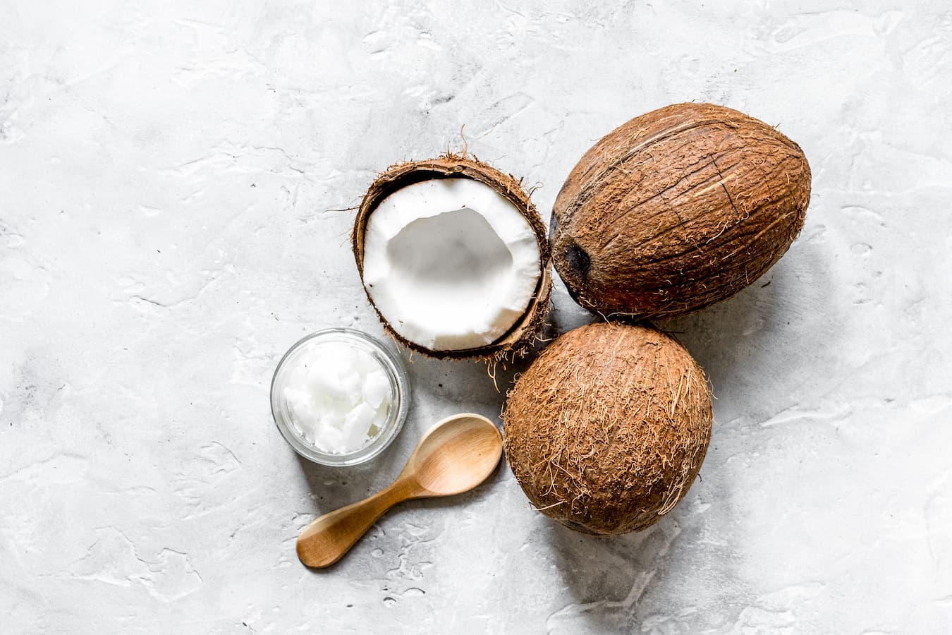 raw coconuts on a countertop weight gain health claims coconut oils body weight loss saturated fat health benefits of coconut weight gain weight loss saturated fat weight loss saturated fat