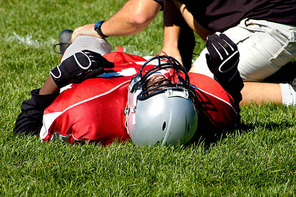 NFL Injury lying on the ground