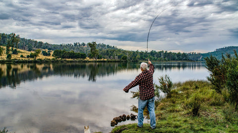 Old Man Fishing on a Lake