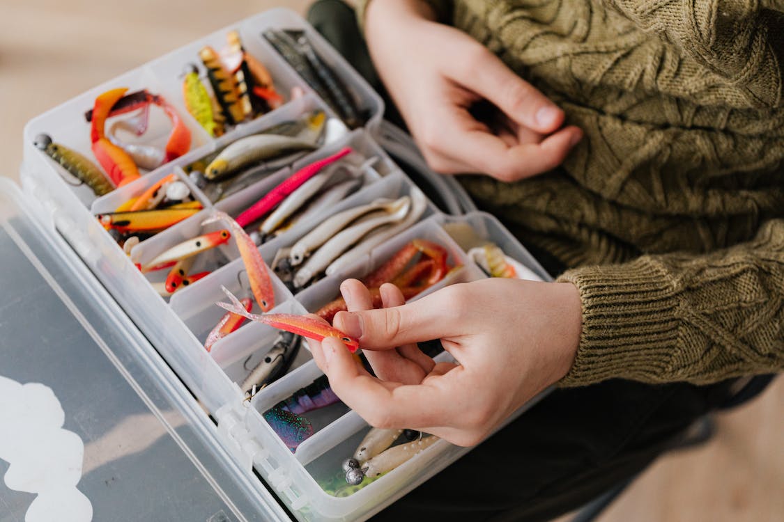Fishing lures in a plastic container