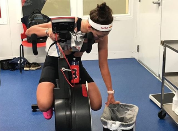 Chloe Dygert doing her favourite Wattbike workout with a trash can