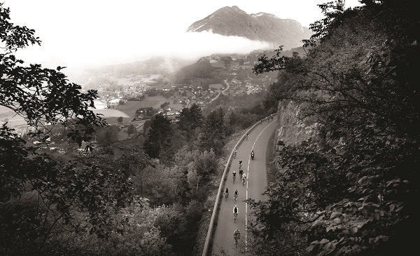 a black and white image of a cycling climbing route among mountains