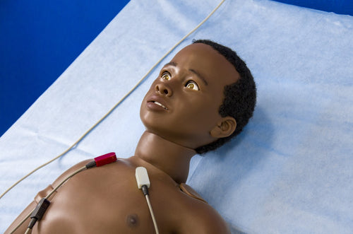 Arthur Paediatric Patient Simulator in bed with ECG leads connected
