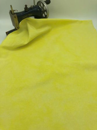 Bright yellow hand dyed linen with mottling.