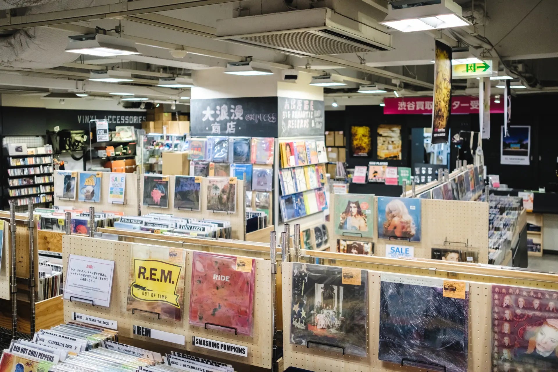 The meticulously arranged record sleeves, with their stylish designs, transform the entire space into a museum