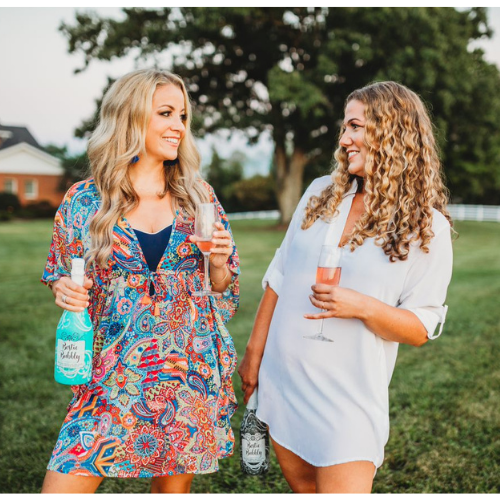 Andrea Weigand and another woman drinking Bestie Bubbly and talking happily