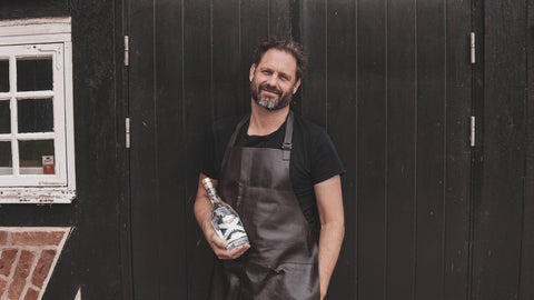 Matthias Tonnesson, master blender at purity distillery with a bottle of purity vodka