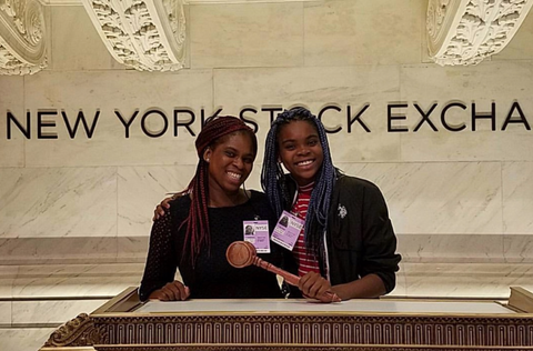 vanessa braxton and her daughter posing at the New York Stock Exchange