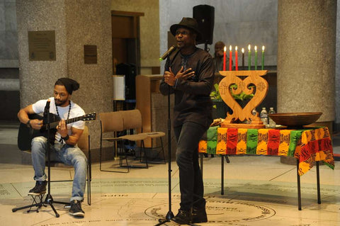 kwanzaa celebration with music and candles