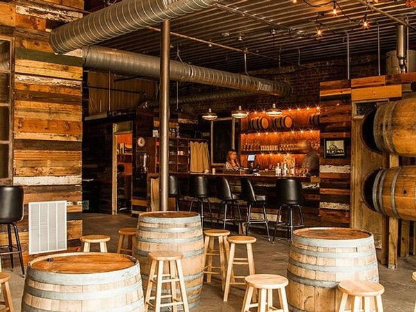 Internal Image of the John Emerald Distillery in Opelika Alabama, showing barrels and machinery