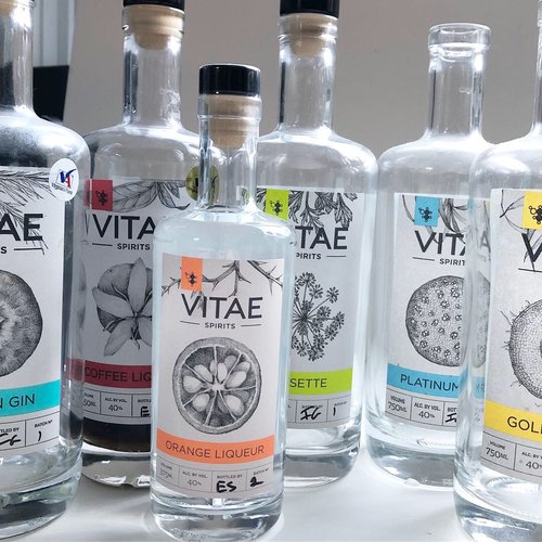 Vitae Spirits bottles with art by Lara Call Gastinger