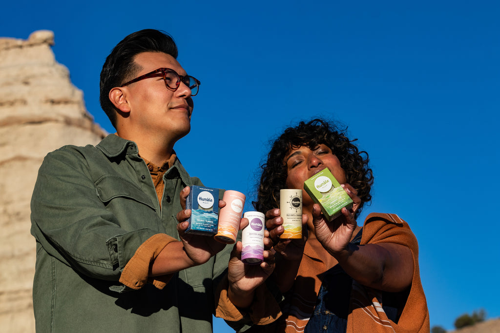Man and Woman Holding Deodorant Collection