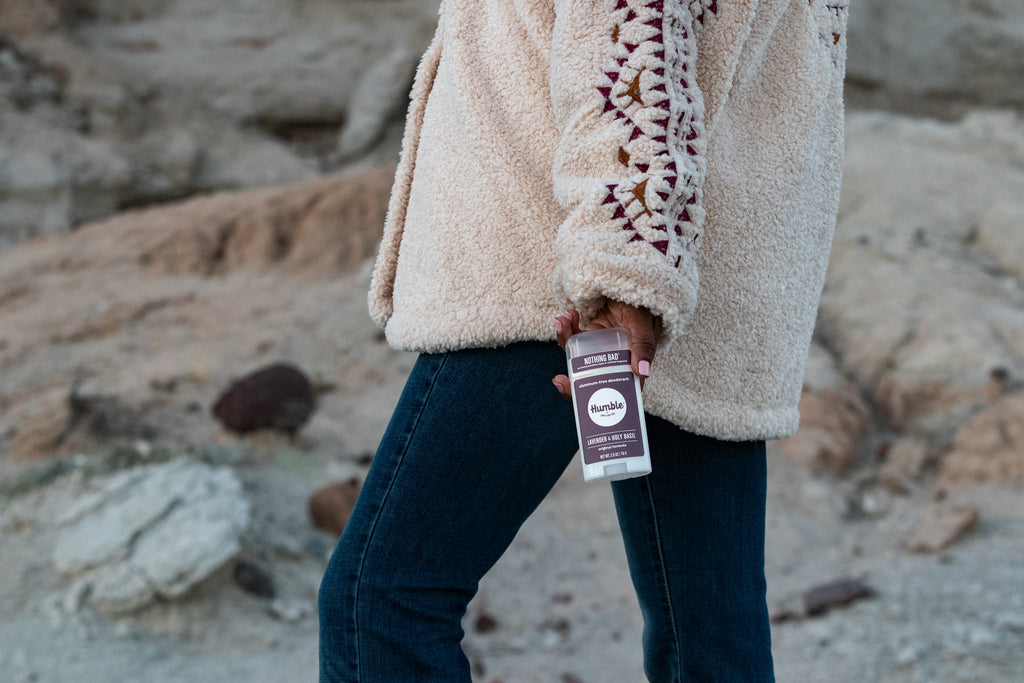 Woman holding Lavender and Holy Basil Deodorant