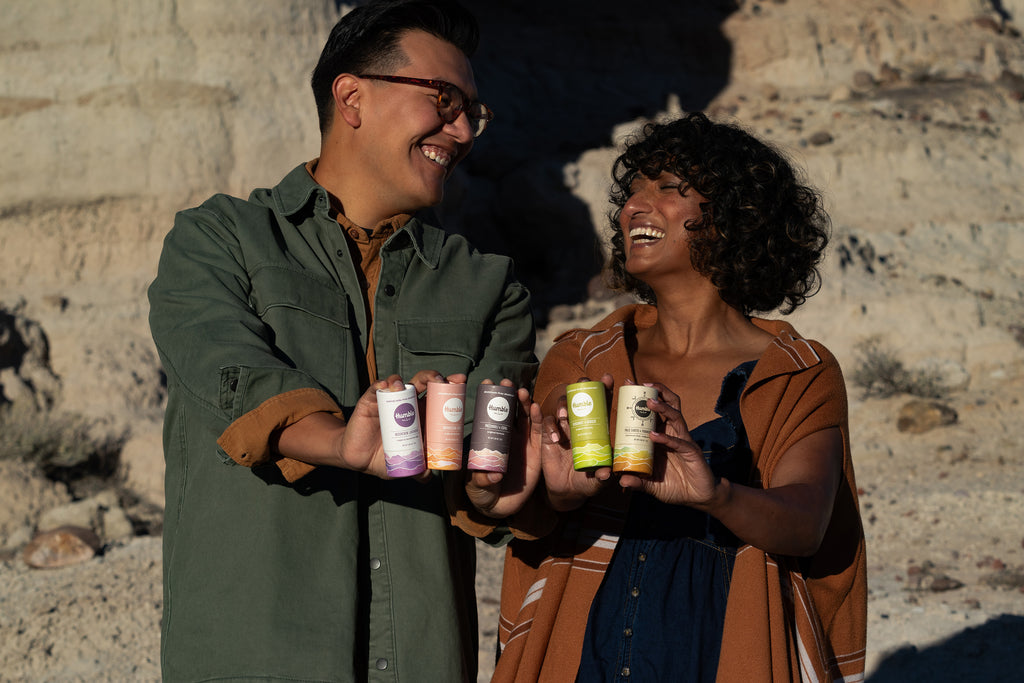 Man and woman holding paperboard deodorant