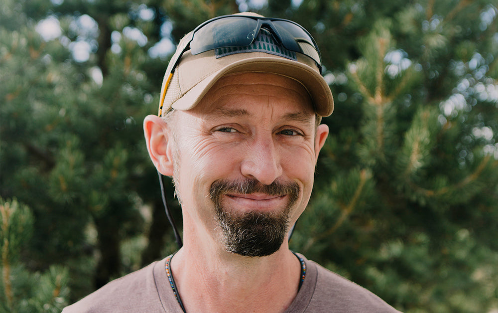 Man in hat smiling