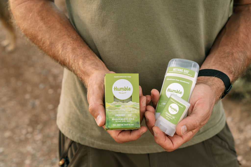 Man holding Lemongrass and Sage soap and deodorant