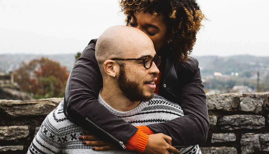 Woman embracing bearded man