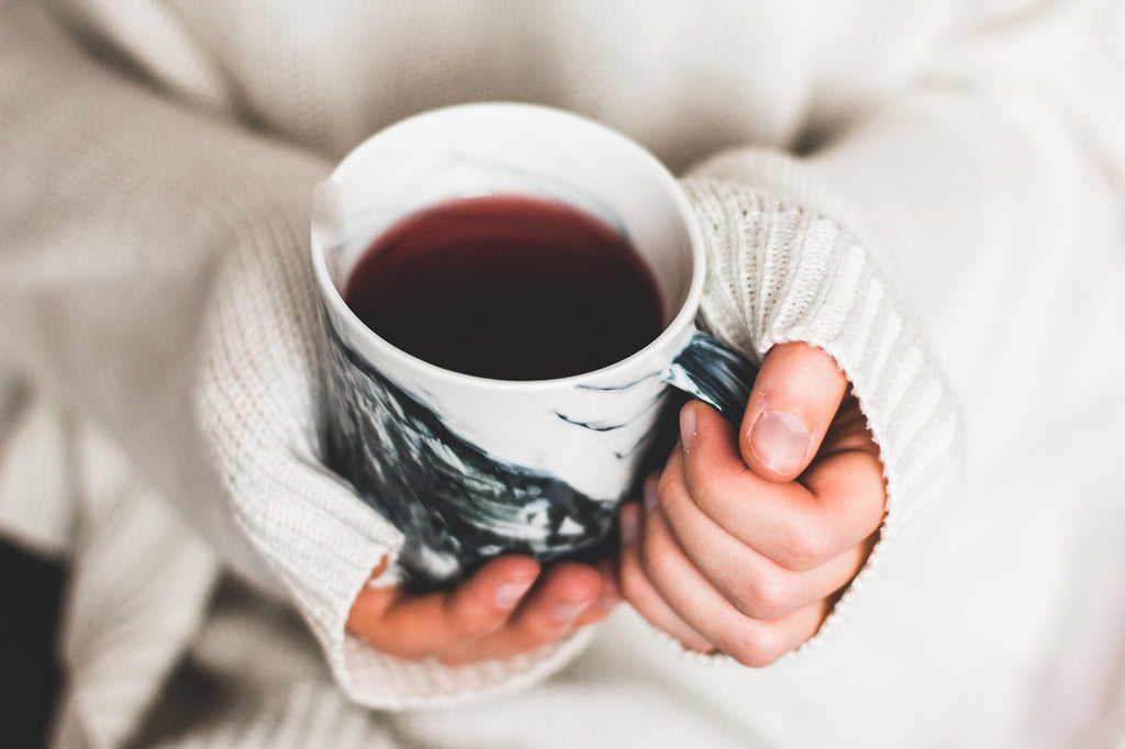 Mug of tea in hands