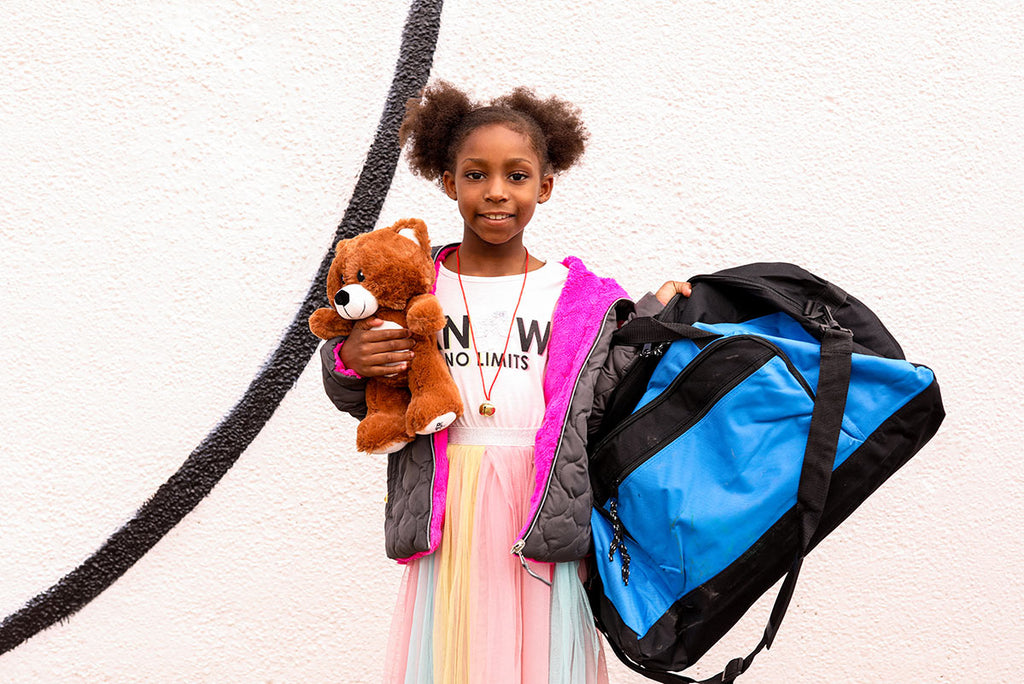 Girl with bag and bear