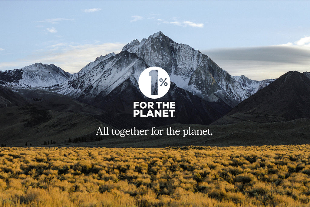 Taos mountain and field with 1% for the Planet logo over the top