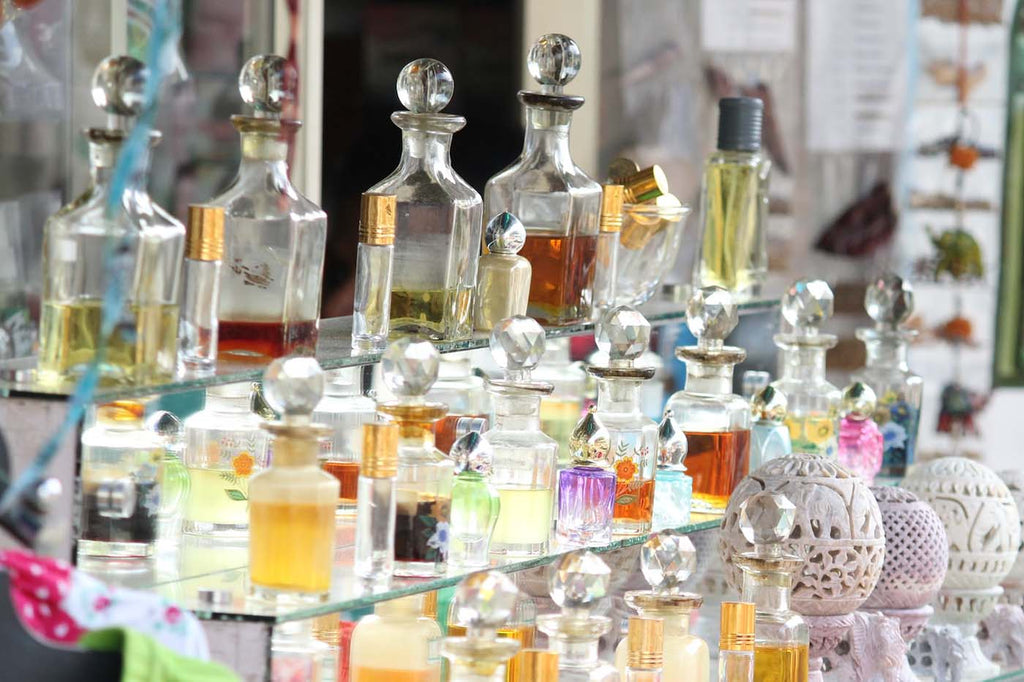 Glass shelves lined with perfumes