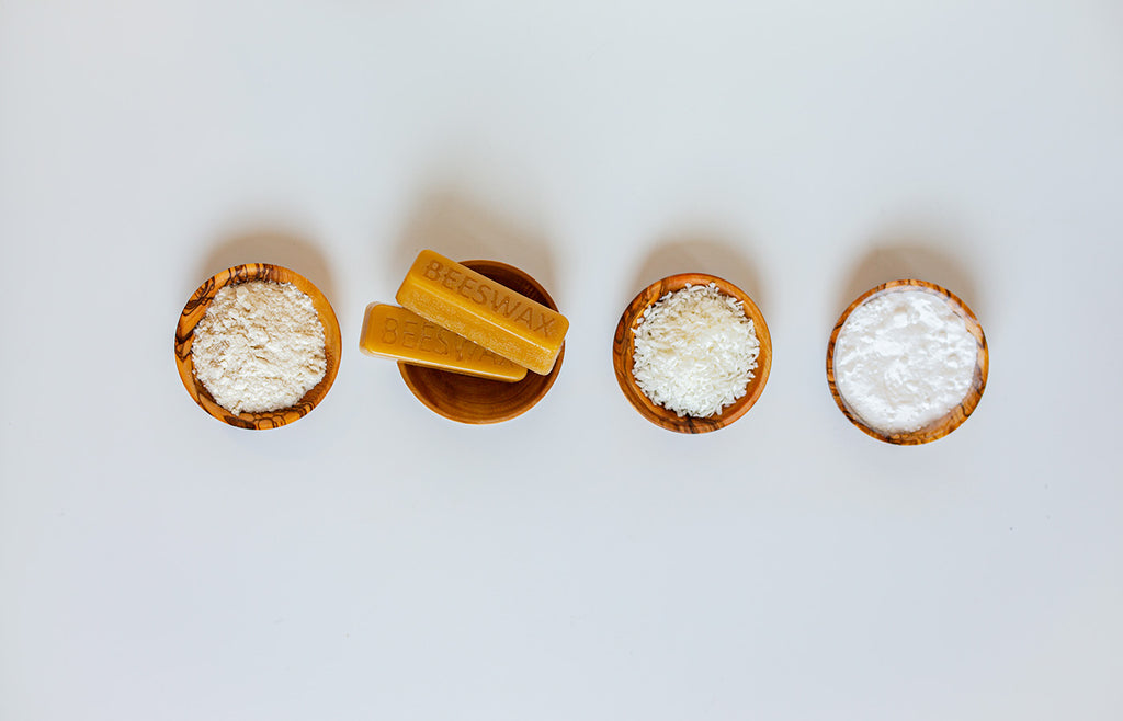 Deodorant ingredients in small wooden bowls