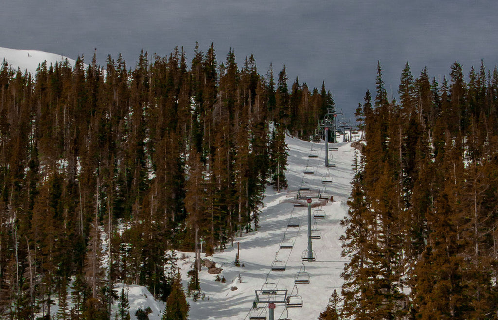 Ski lifts heading up the mountain at Taos Ski Valley mountainside