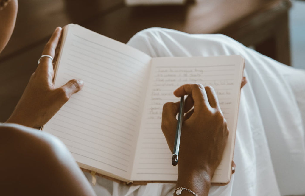 Woman writing in journal