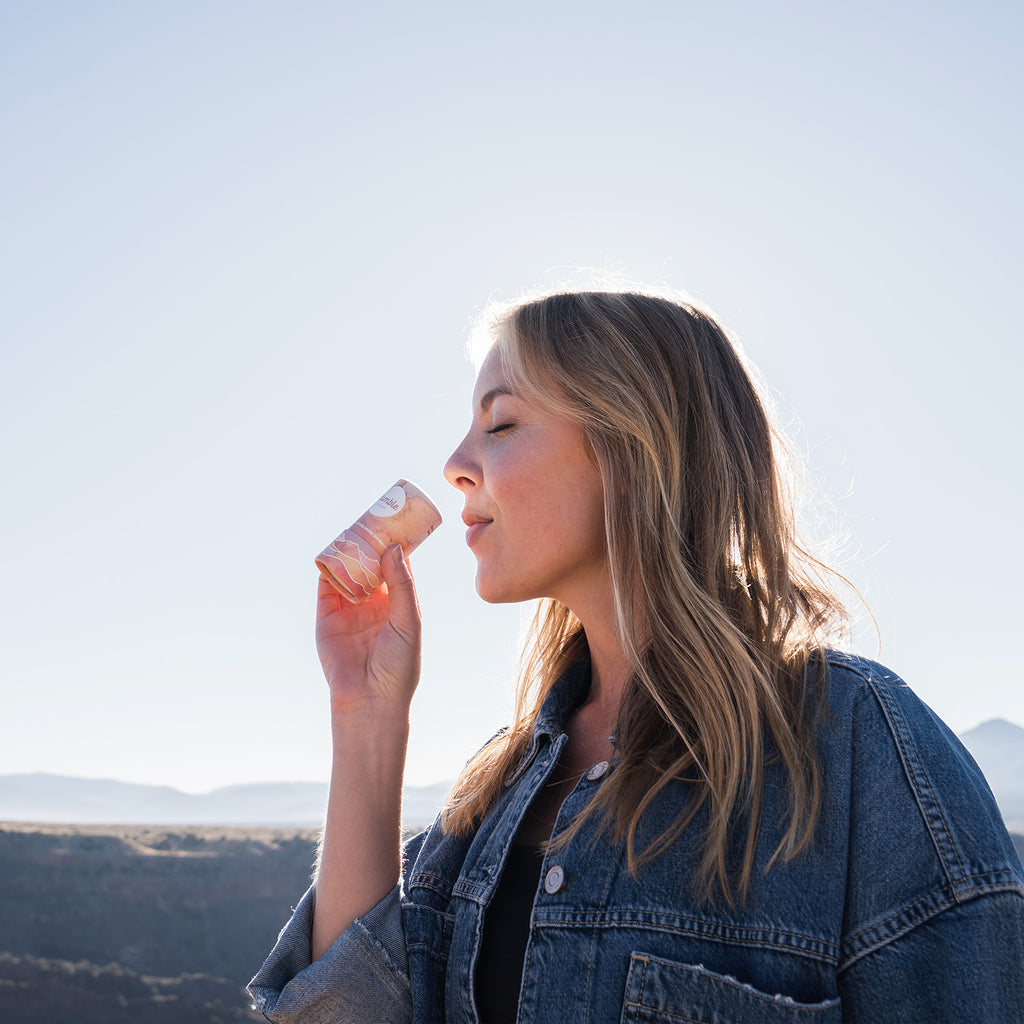 woman smelling Moroccan Rose deodorant