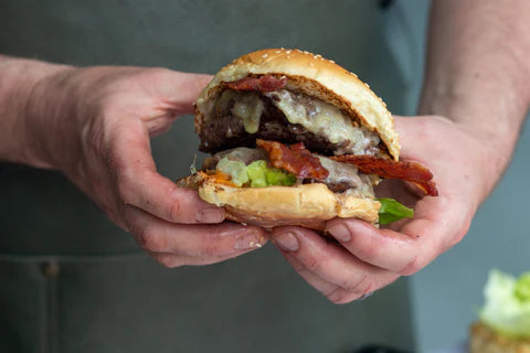 Man holding a Wagyu burger