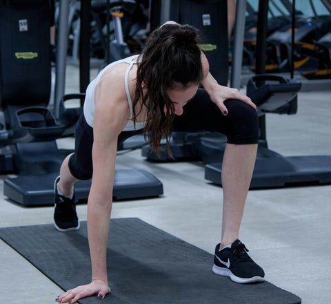 woman-stretching-ankle