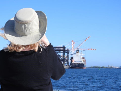 Laura Waller photographing the container ships.