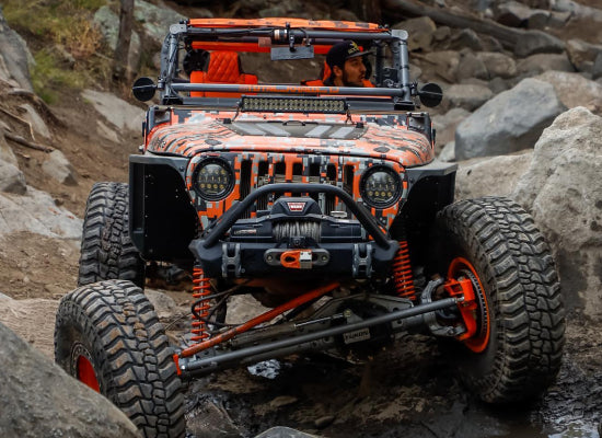 2006 Customized Jeep Wrangler crawling on rocks