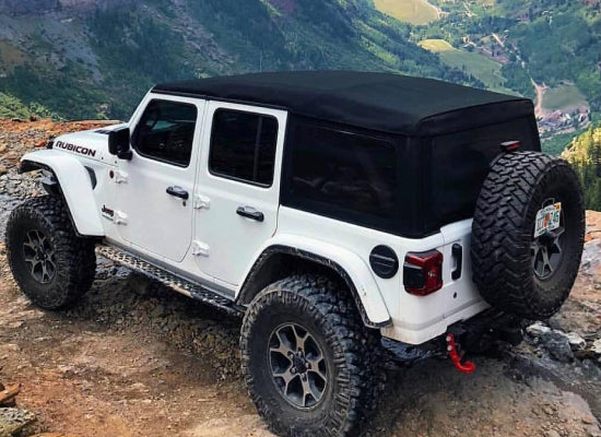 White Jeep Wrangler with a soft top