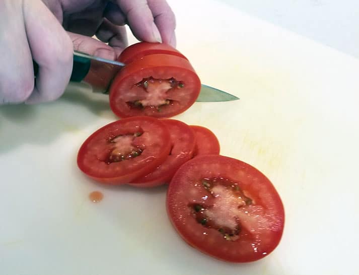 Our Place Chefs KNife Cutting Tomatoes