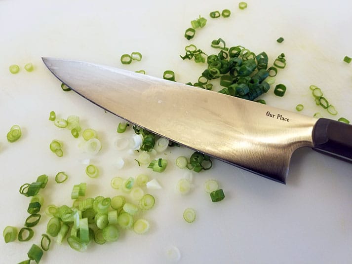 Our Place Chefs KNife Cutting Tomatoes