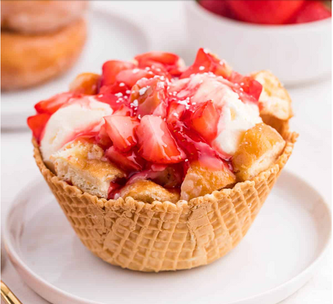 jelly donut icecream in cone bowl sitting on white plate