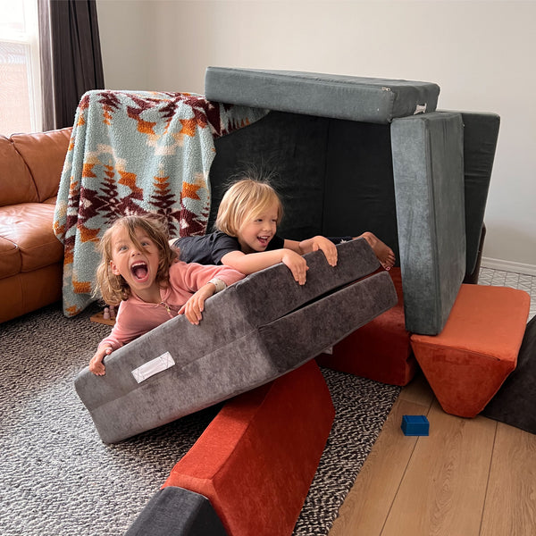 kids playing on a sofa